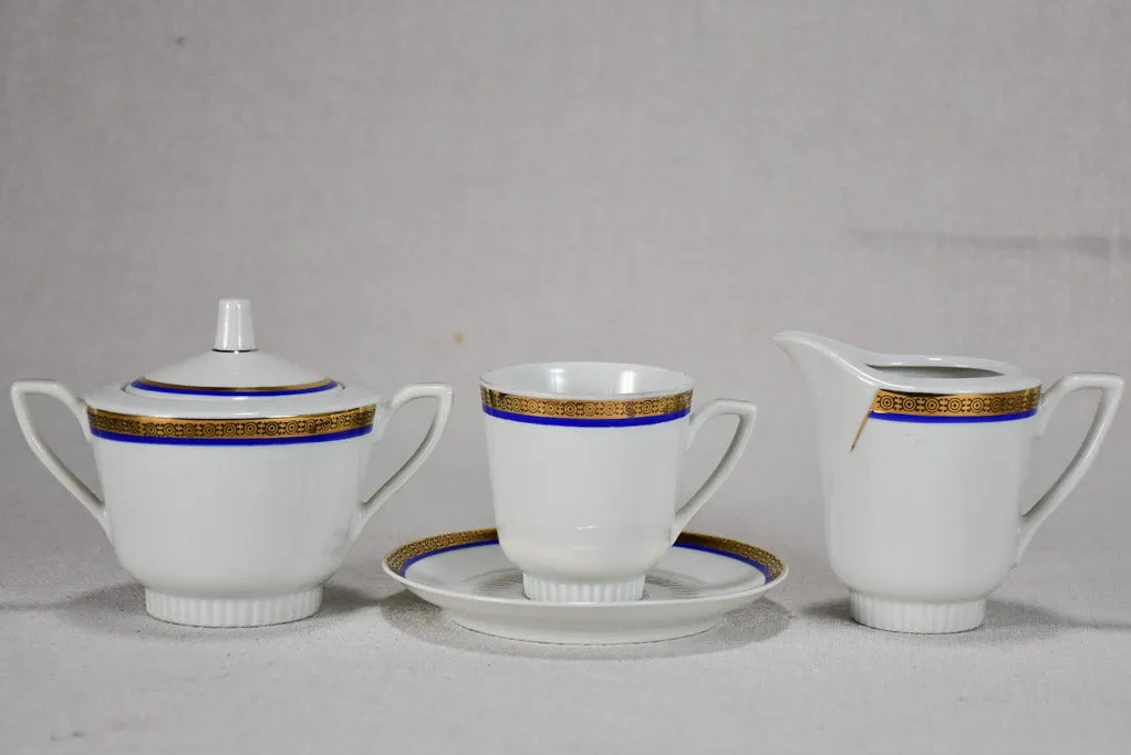 Vintage dinnerware with blue and gold trim