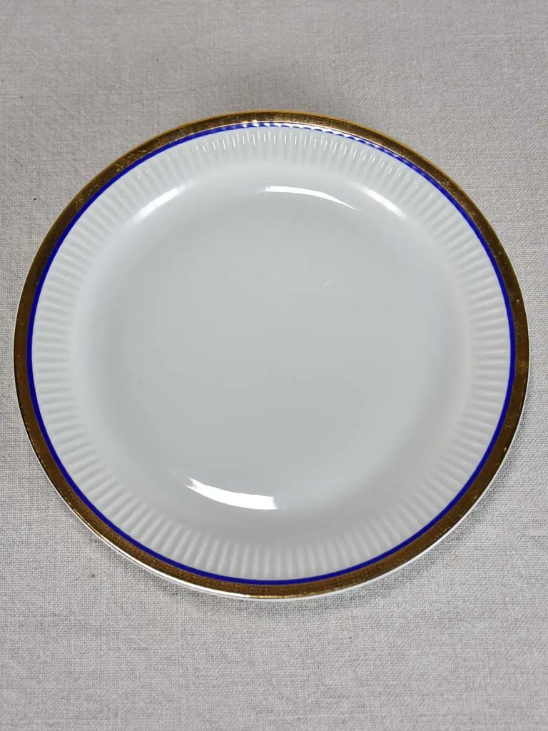 Vintage dinnerware with blue and gold trim